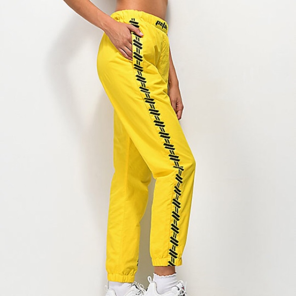 Petals and peacocks yellow track pants